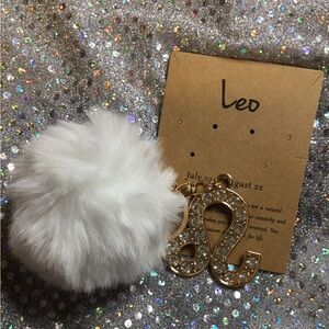 Chic White Pom Pom Keychain with Gold Leo Charm